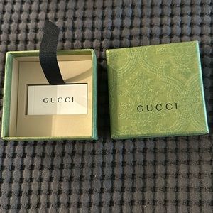 Small Gucci box with ribbon.